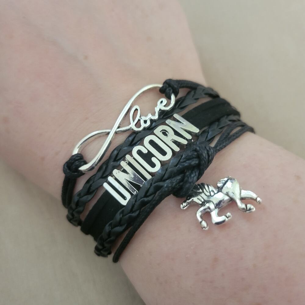 Unicorn charm bracelet, black layered band with silver-tone charms